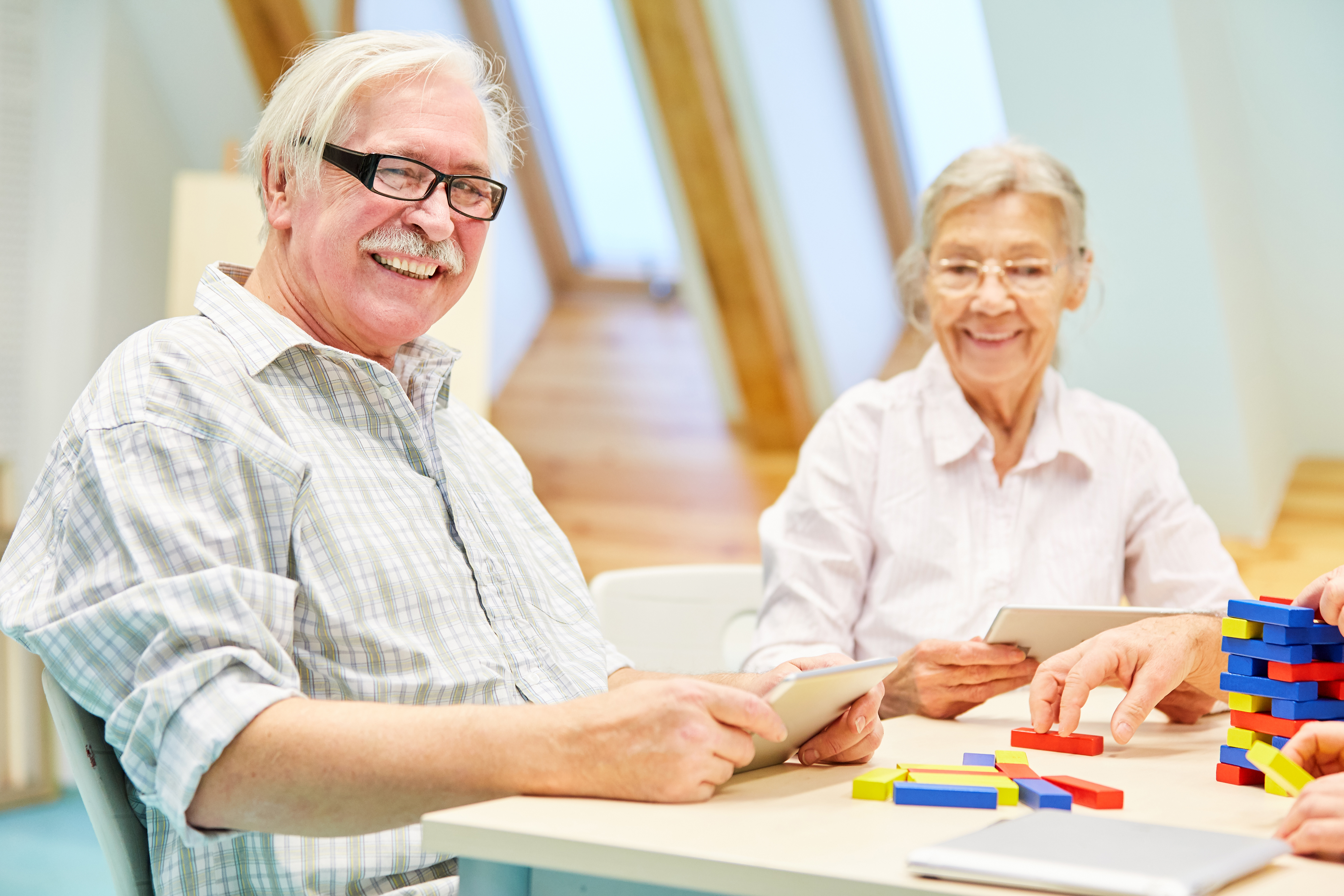 Seniors engaged in activities at an adult day care center
