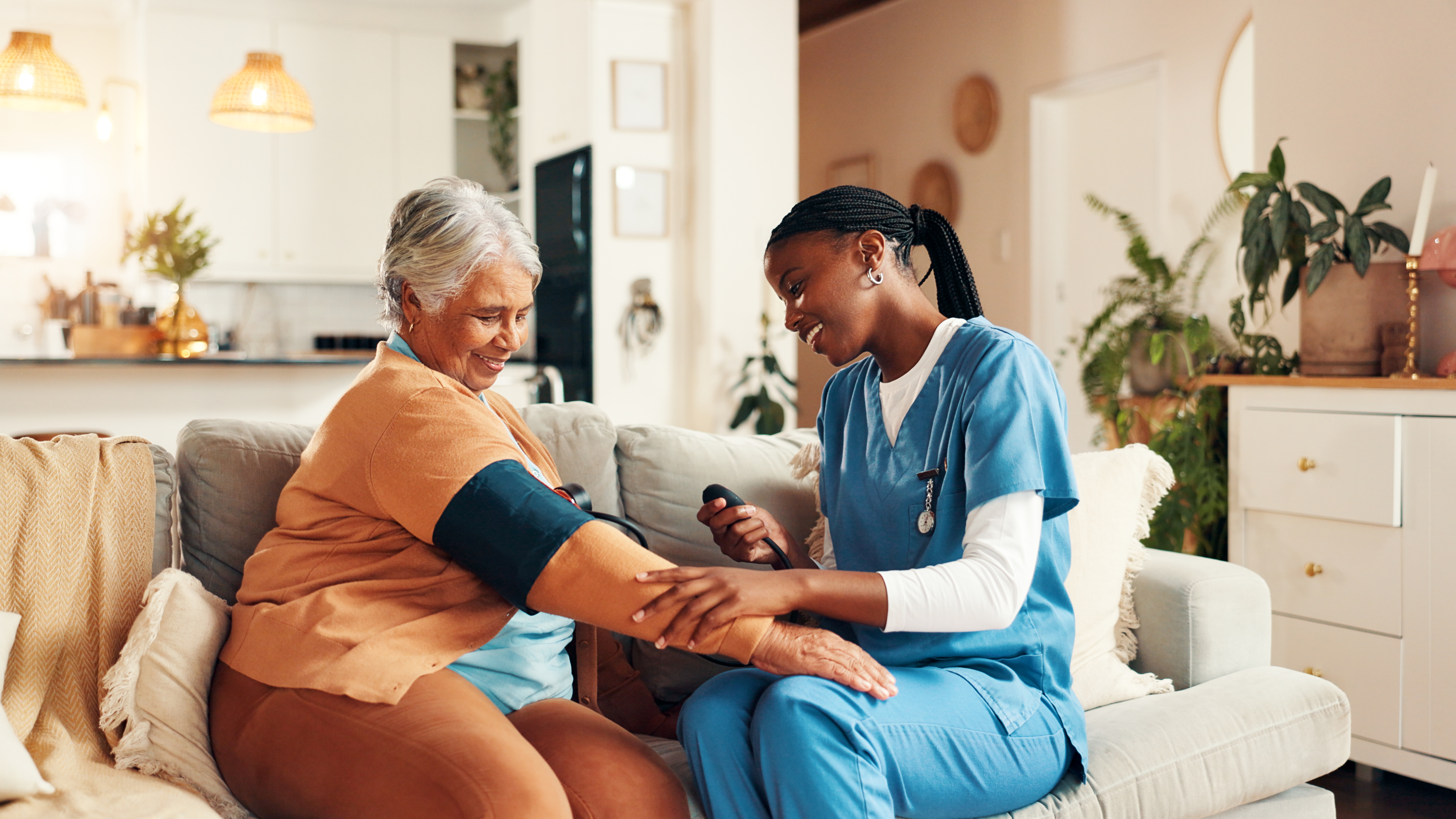 Home care aide assisting a senior at home